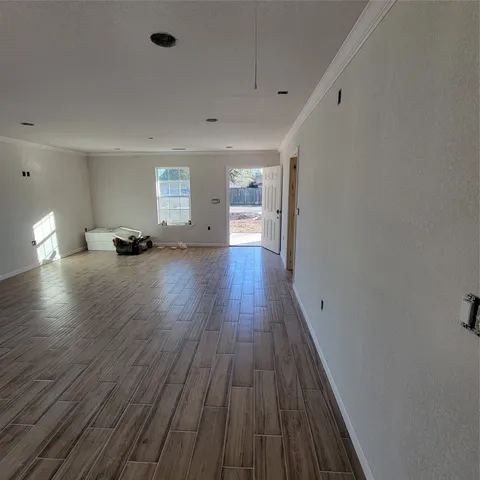 a view of a livingroom with wooden floor