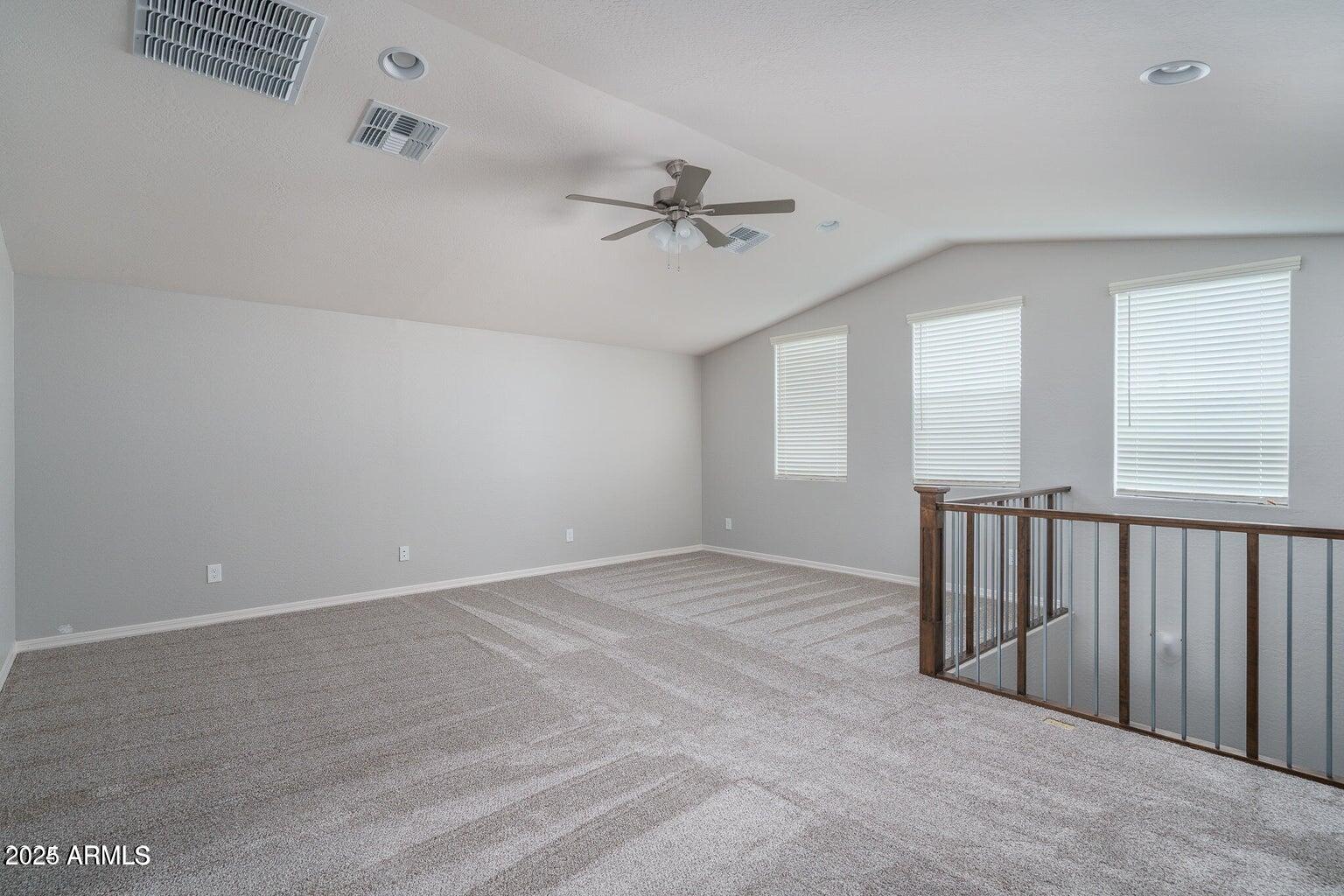 16172 West Alameda Road Surprise, AZ 85387 - Photo 16 of 53 an empty room with windows and fan