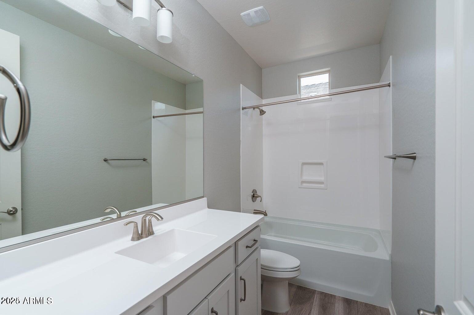 16172 West Alameda Road Surprise, AZ 85387 - Photo 24 of 53 a bathroom with a sink a toilet and shower