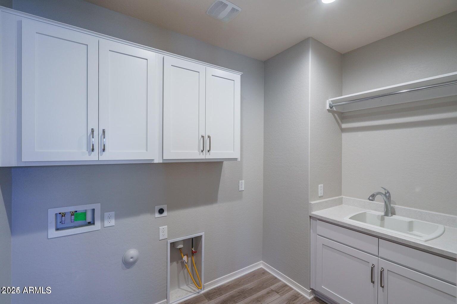 16172 West Alameda Road Surprise, AZ 85387 - Photo 25 of 53 a view of cabinets and utility room
