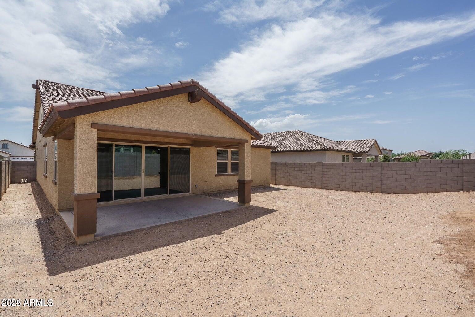 16172 West Alameda Road Surprise, AZ 85387 - Photo 29 of 53 a front view of a house with a yard