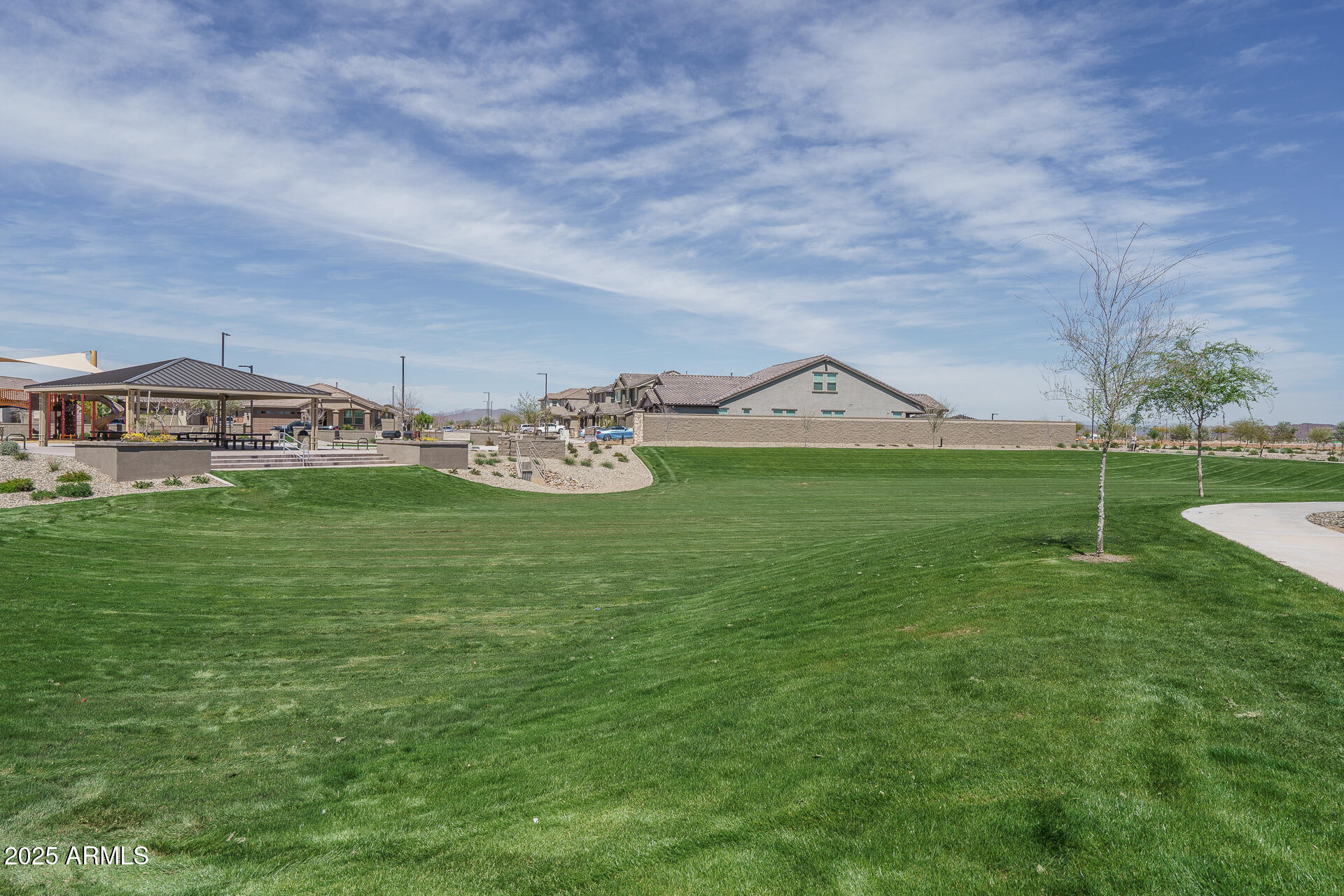 16172 West Alameda Road Surprise, AZ 85387 - Photo 37 of 53 a view of a terrace with lawn chairs and iron fence