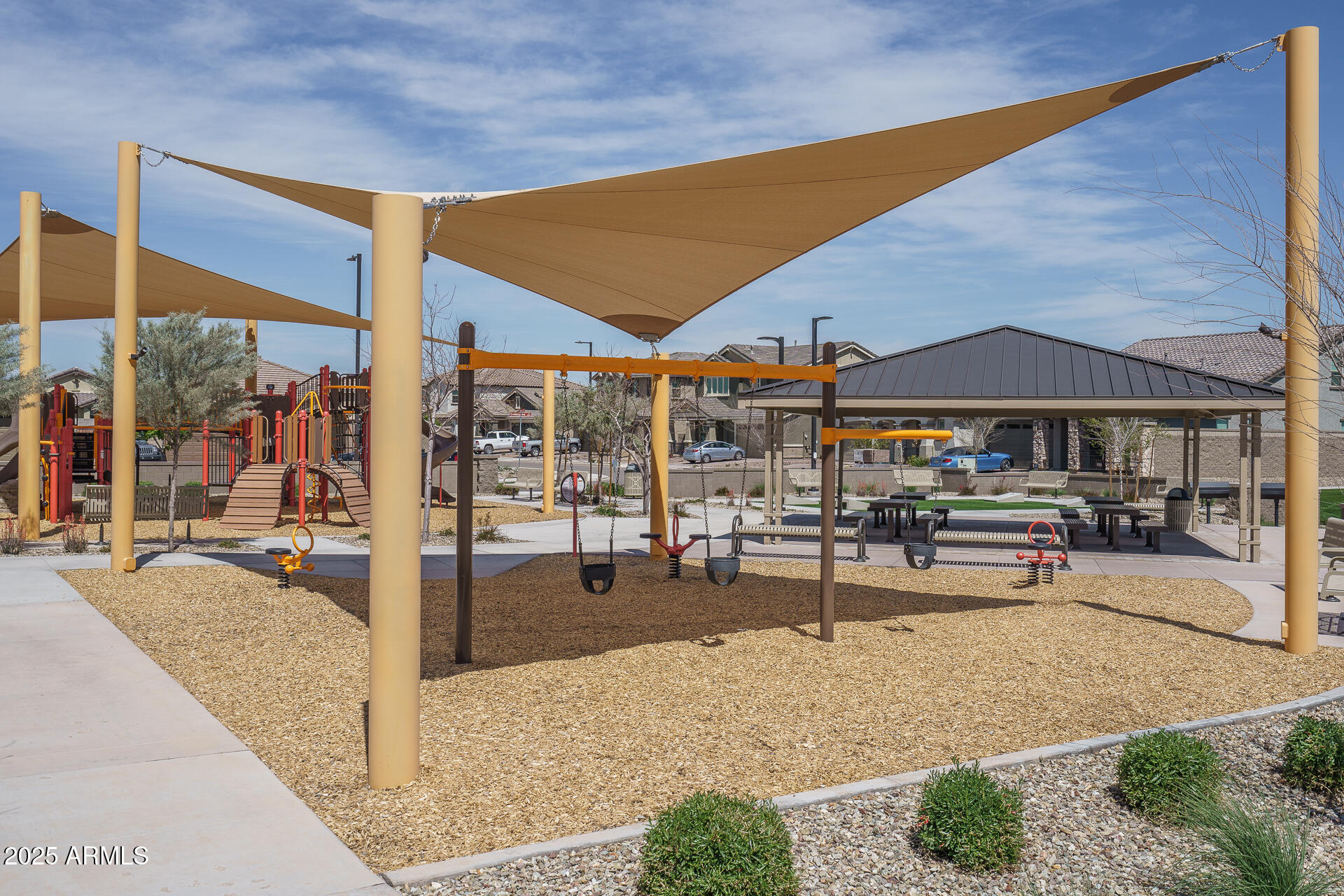 16172 West Alameda Road Surprise, AZ 85387 - Photo 40 of 53 a view of a patio with table and chairs under an umbrella
