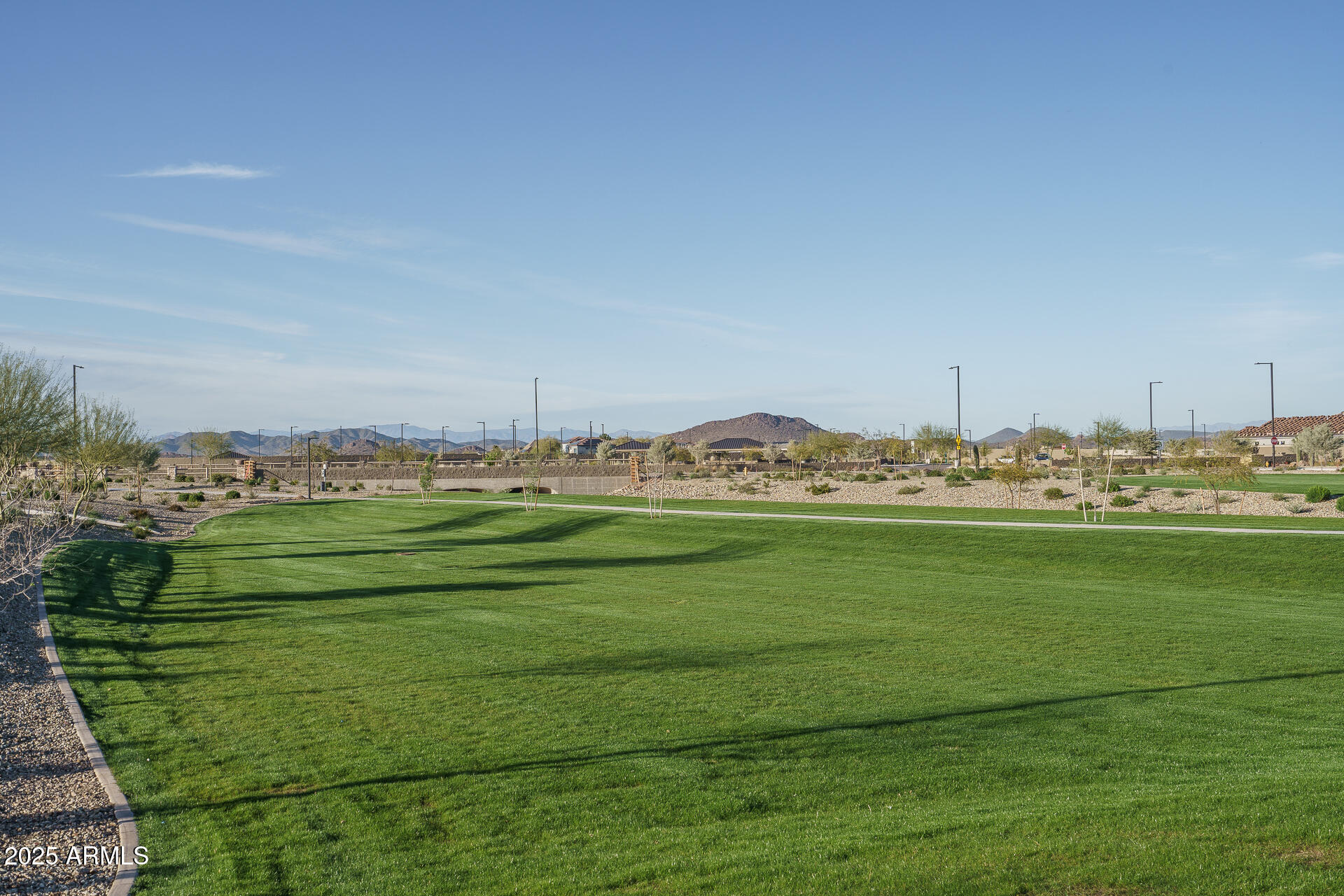 16172 West Alameda Road Surprise, AZ 85387 - Photo 41 of 53 a view of a grassy field with an trees