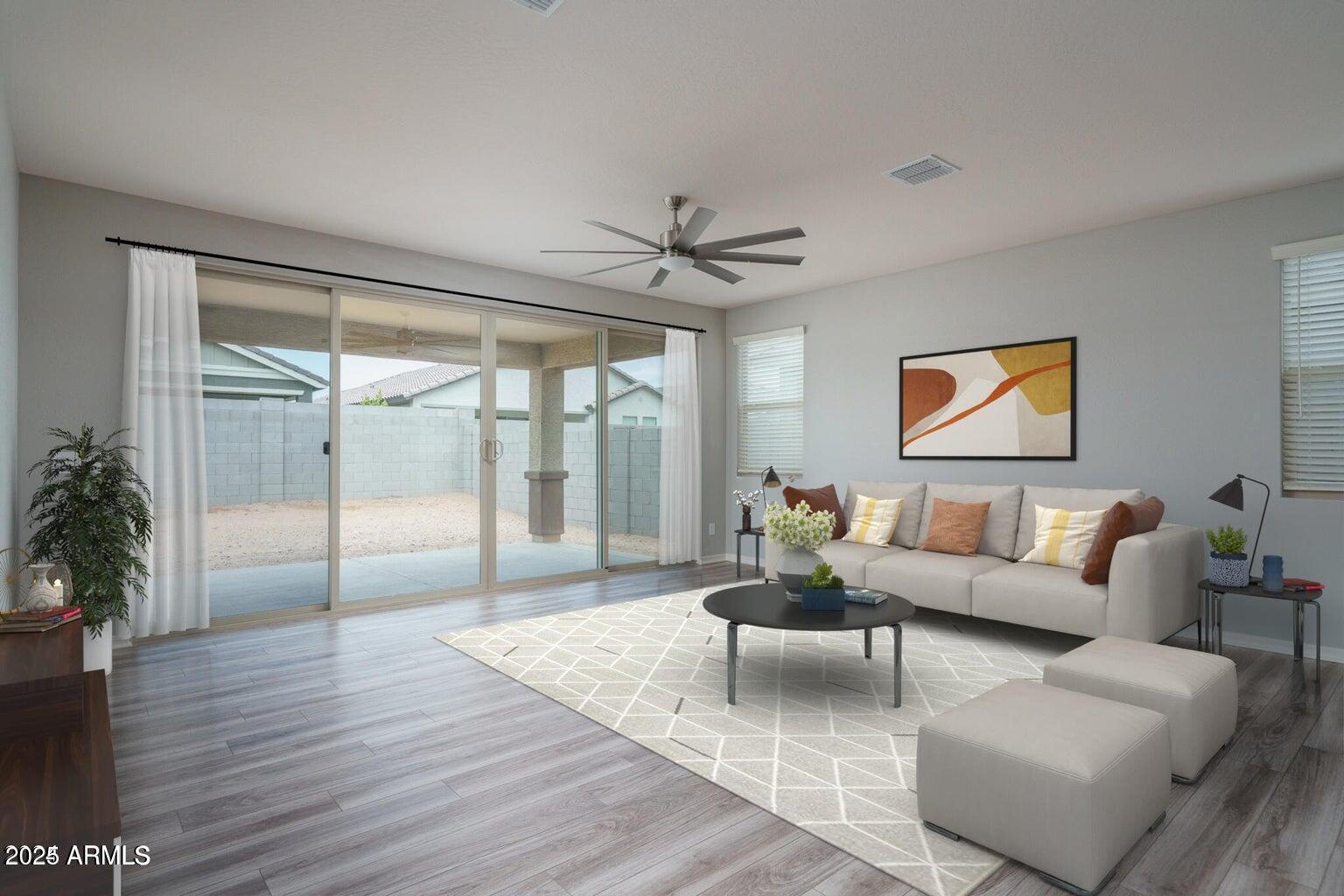 16172 West Alameda Road Surprise, AZ 85387 - Photo 8 of 53 a living room with furniture ceiling fan and a large window