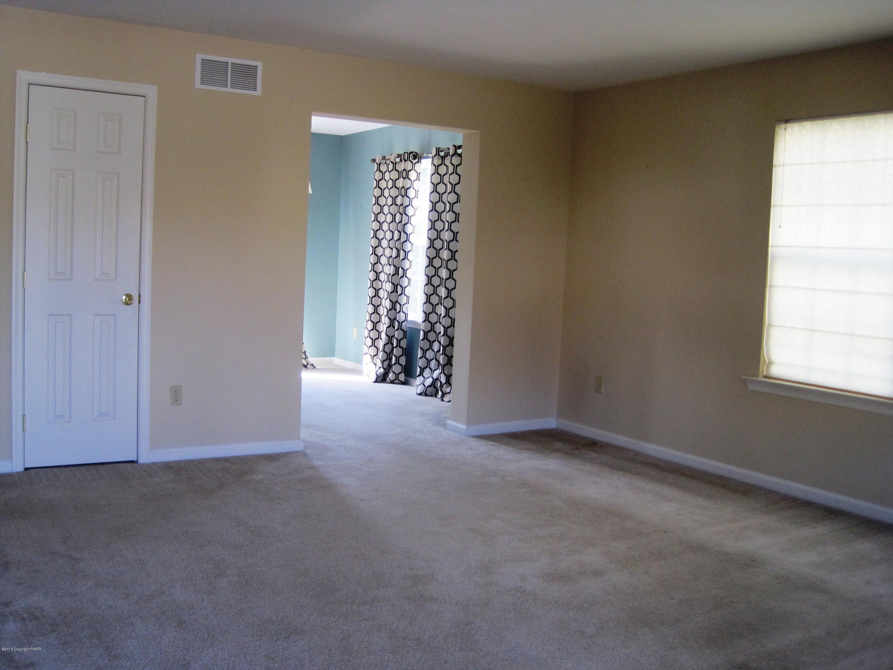 60 Lower Ridgeview Circle East Stroudsburg, PA 18302 - Photo 6 of 12 an empty room with windows