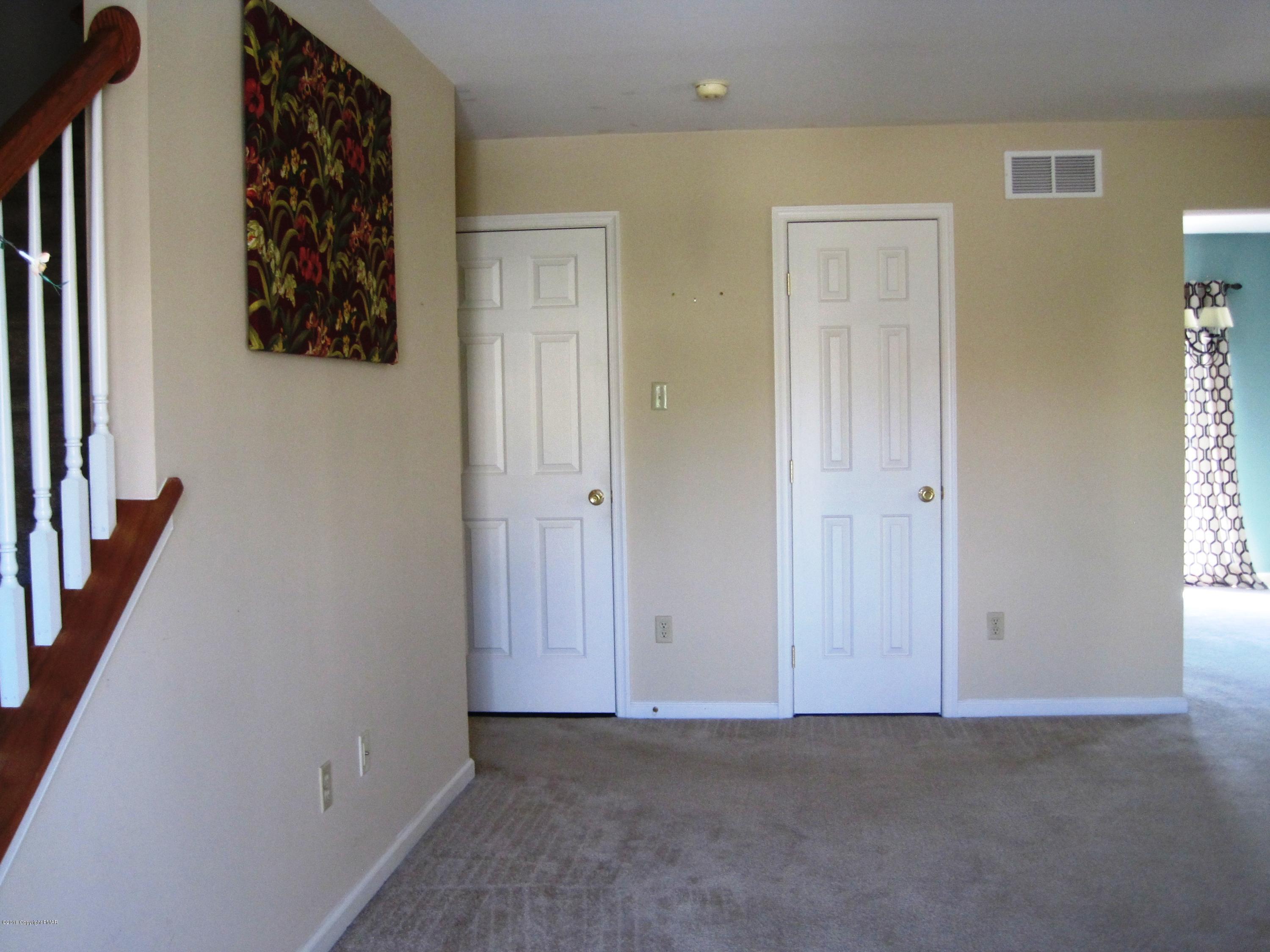 60 Lower Ridgeview Circle East Stroudsburg, PA 18302 - Photo 7 of 12 an empty room with windows