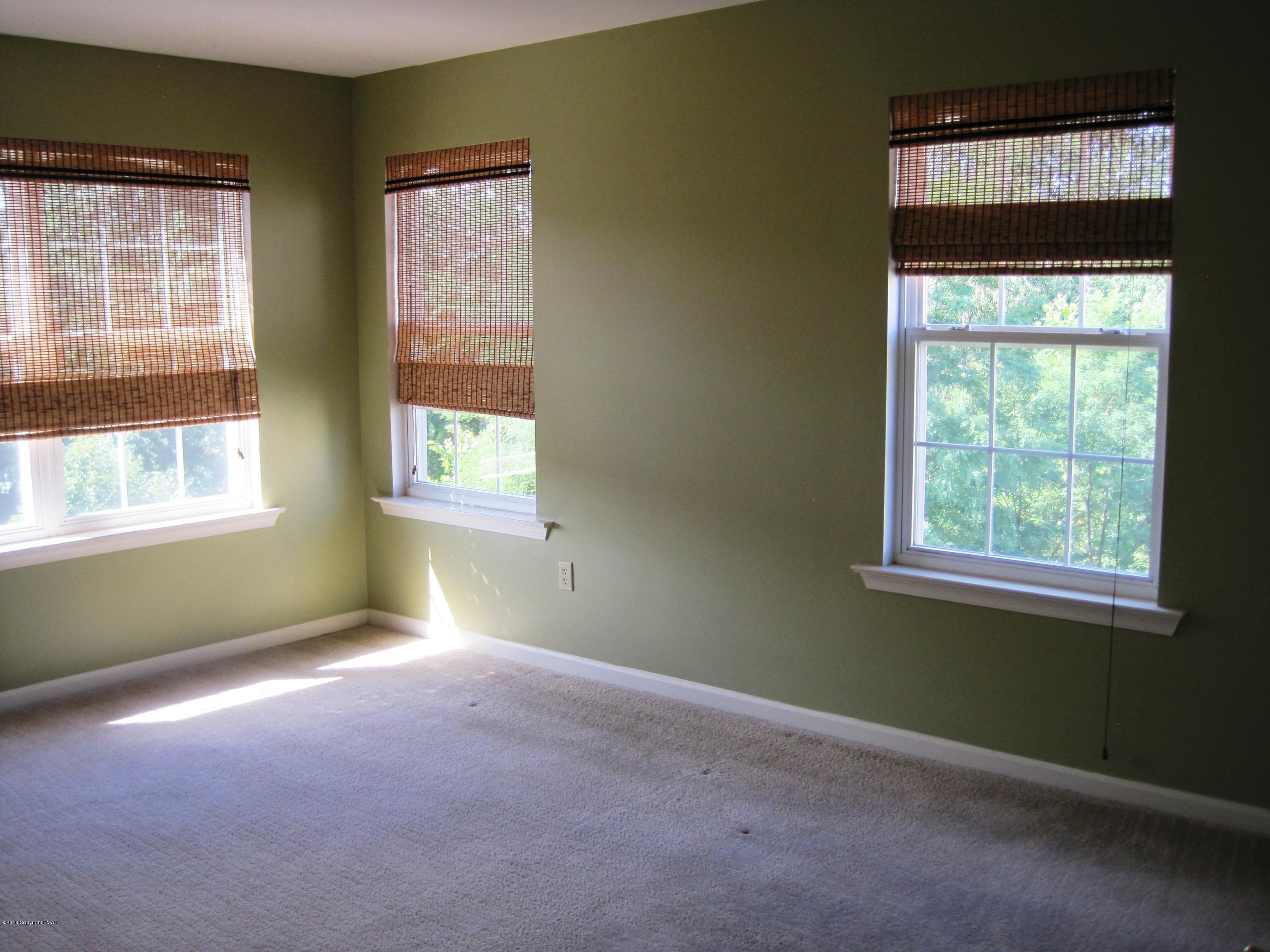 60 Lower Ridgeview Circle East Stroudsburg, PA 18302 - Photo 8 of 12 an empty room with a window