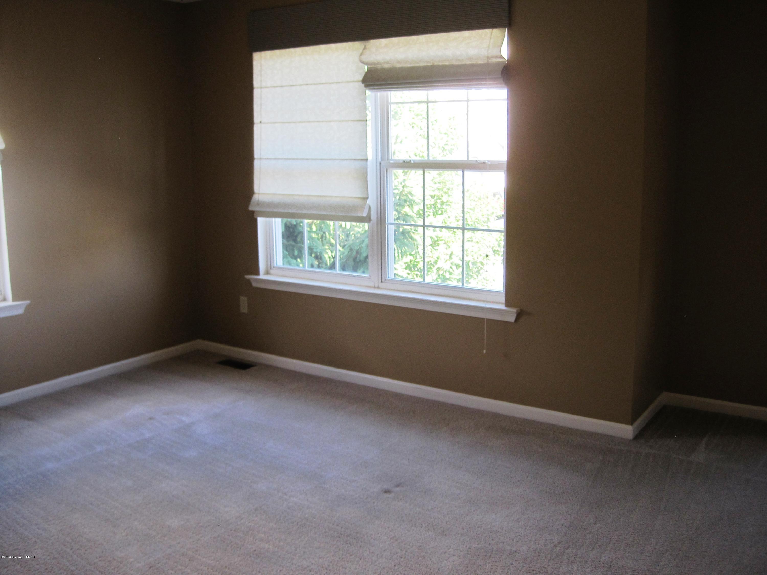 60 Lower Ridgeview Circle East Stroudsburg, PA 18302 - Photo 9 of 12 an empty room with a window