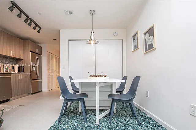 a view of a dining room with furniture