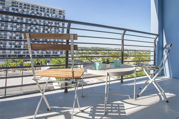 a room with lots of chairs and mirrors