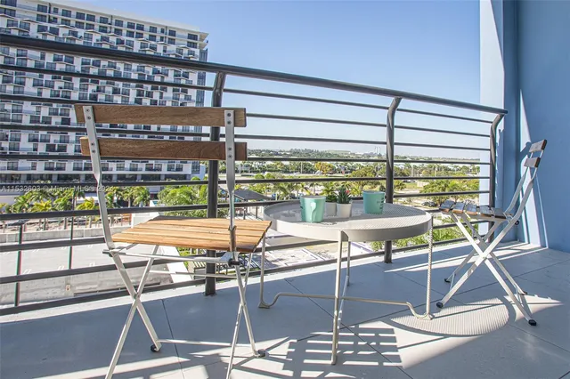 a room with lots of chairs and mirrors