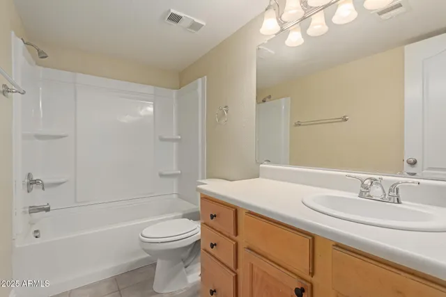 a bathroom with a shower and a sink