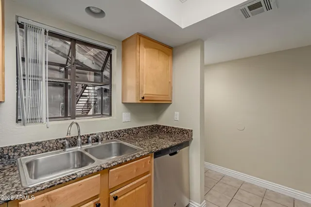 a view white cabinets and a sink