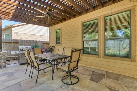 a patio with table and chairs