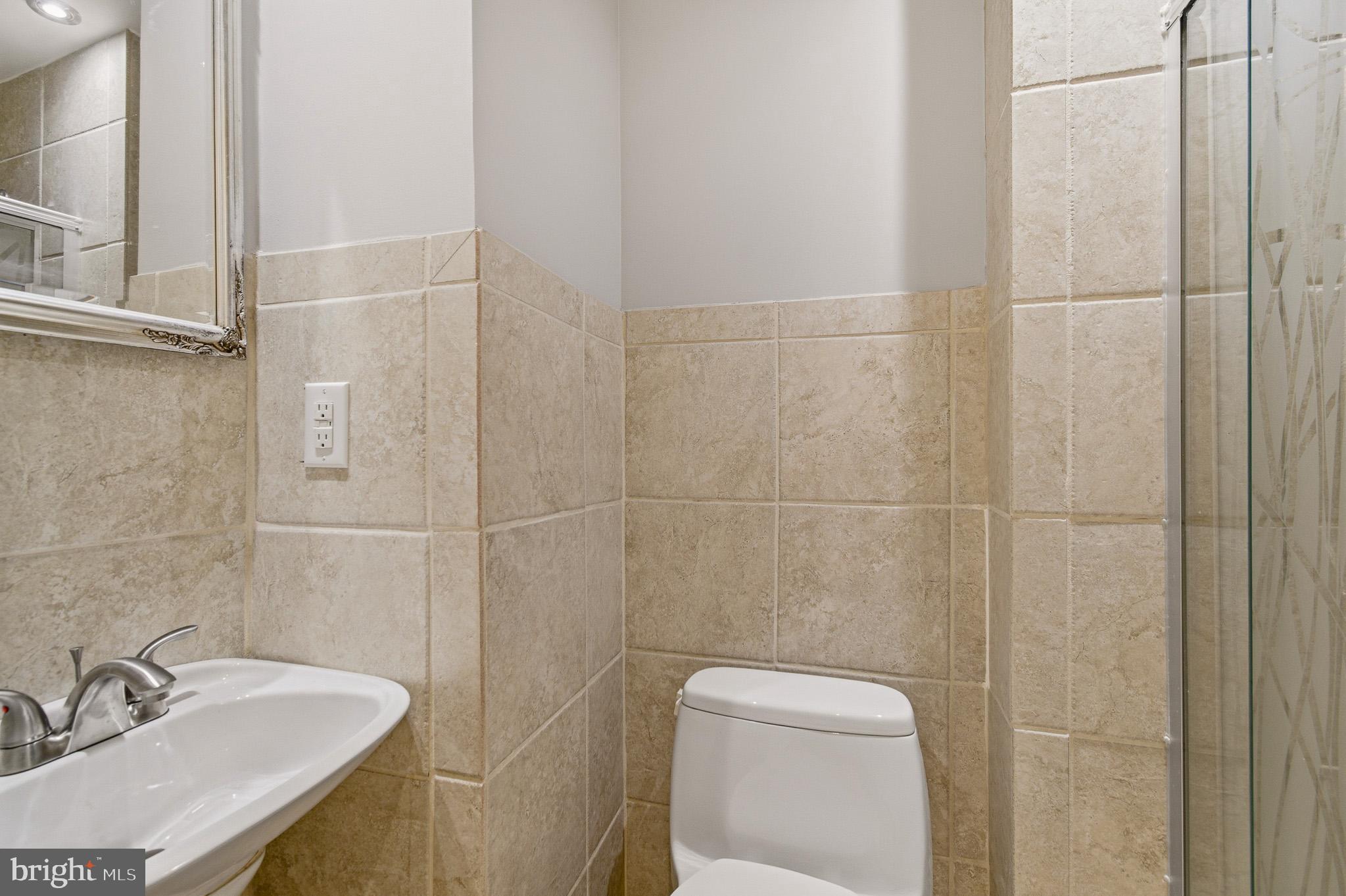 2117 S Street Northwest Washington, DC 20008 - Photo 61 of 63 a bathroom with a sink toilet and shower