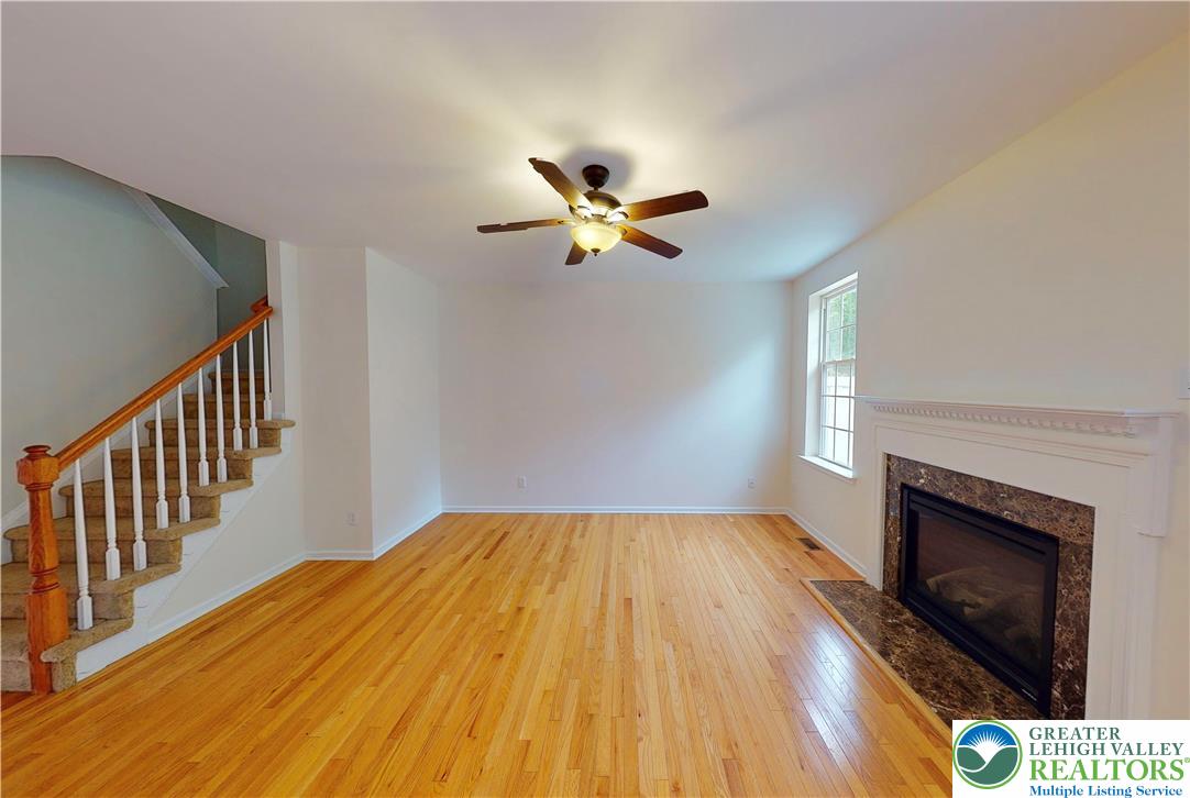 1824 Big Ridge Drive East Stroudsburg, PA 18302 - Photo 12 of 46 a bedroom with a bed and a fireplace