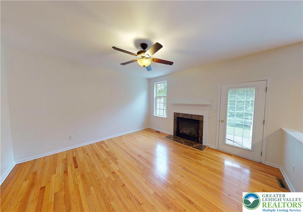 1824 Big Ridge Drive East Stroudsburg, PA 18302 - Photo 17 of 46 a view of empty room with fireplace and wooden floor