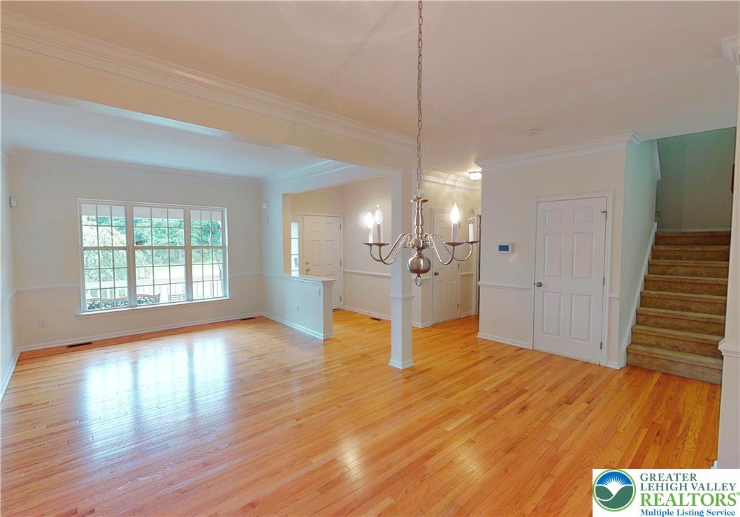 1824 Big Ridge Drive East Stroudsburg, PA 18302 - Photo 19 of 46 a view of a room with wooden floor staircase and a kitchen