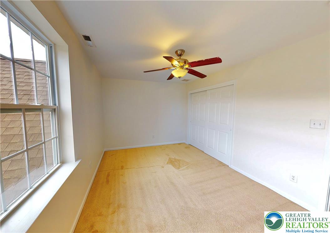 1824 Big Ridge Drive East Stroudsburg, PA 18302 - Photo 25 of 46 a view of a room with a ceiling fan and a large window