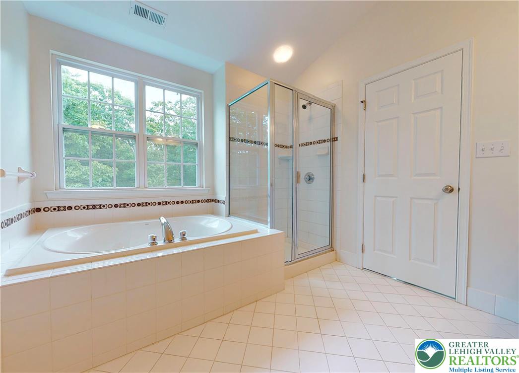 1824 Big Ridge Drive East Stroudsburg, PA 18302 - Photo 33 of 46 a spacious bathroom with a tub and shower