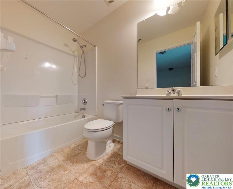 1824 Big Ridge Drive East Stroudsburg, PA 18302 - Photo 34 of 46 a bathroom with a toilet a sink and a bathtub