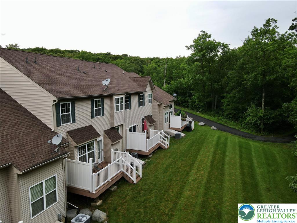 1824 Big Ridge Drive East Stroudsburg, PA 18302 - Photo 45 of 46 a aerial view of a house with a yard table and chairs