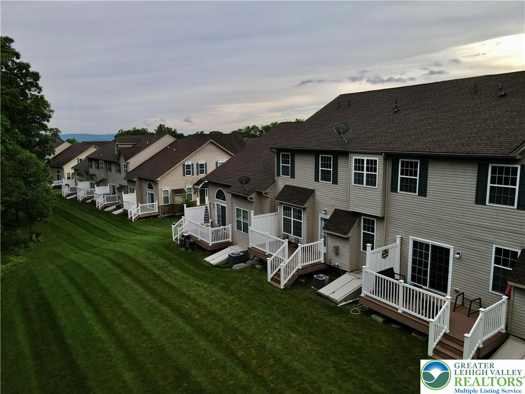 1824 Big Ridge Drive East Stroudsburg, PA 18302 - Photo 46 of 46 a front view of a house with a garden and trees
