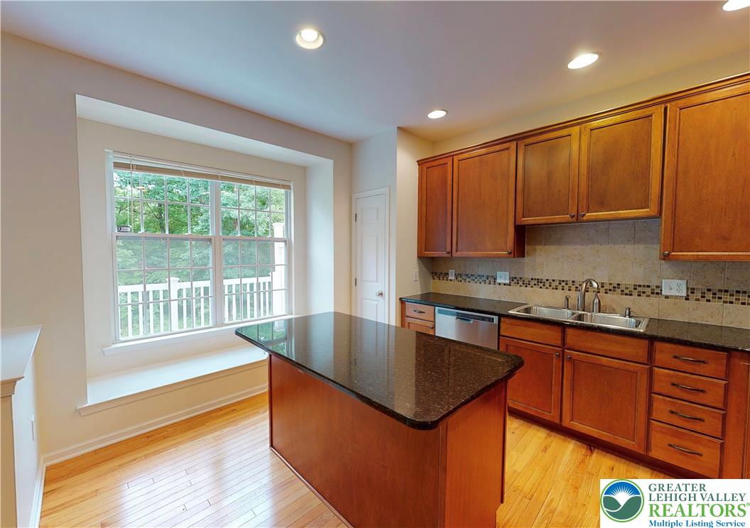 1824 Big Ridge Drive East Stroudsburg, PA 18302 - Photo 7 of 46 a kitchen with stainless steel appliances granite countertop a sink stove and cabinets
