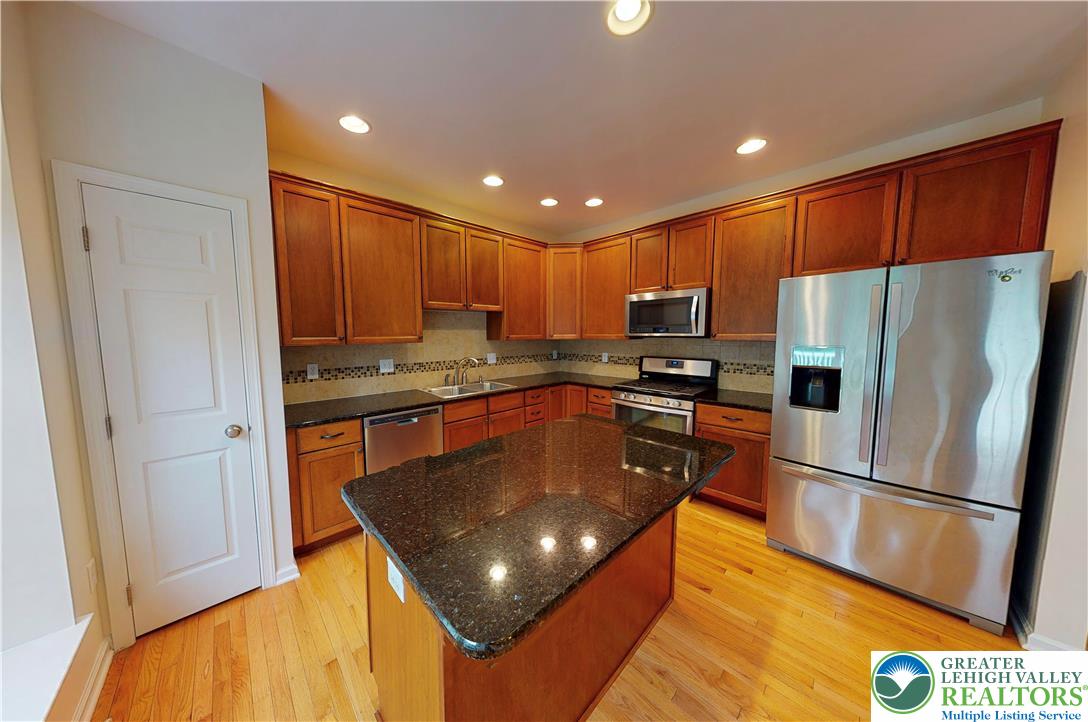 1824 Big Ridge Drive East Stroudsburg, PA 18302 - Photo 9 of 46 a kitchen with stainless steel appliances granite countertop a refrigerator a stove a sink and a refrigerator