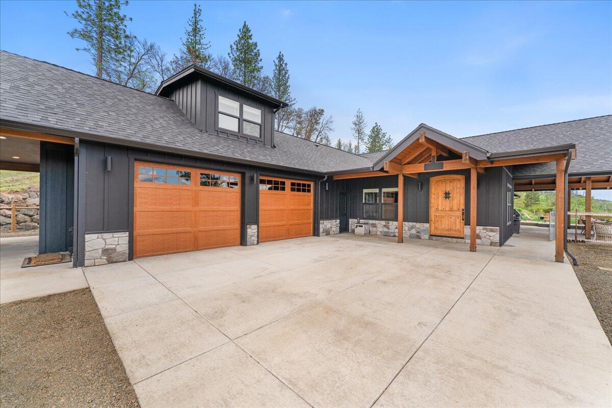 2220 Butte Falls Highway Eagle Point, OR 97524 - Photo 6 of 69 a front view of a house with a yard and garage
