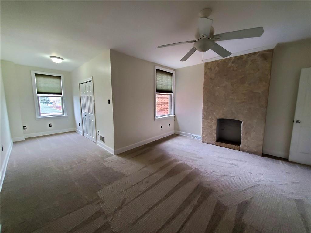 905 Deely Street Pittsburgh, PA 15217 - Photo 15 of 19 an empty room with windows and fireplace