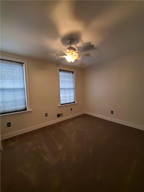 905 Deely Street Pittsburgh, PA 15217 - Photo 16 of 19 an empty room with a window and a ceiling fan
