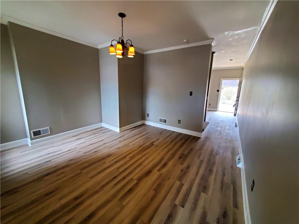 905 Deely Street Pittsburgh, PA 15217 - Photo 4 of 19 a view of empty room with wooden floor