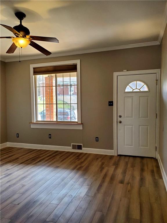 905 Deely Street Pittsburgh, PA 15217 - Photo 7 of 19 a view of an empty room with window and wooden floor