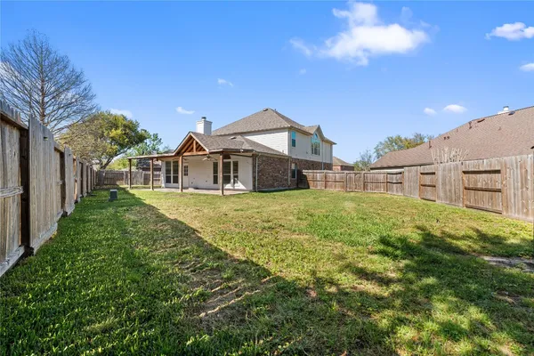 a view of a house with a big yard
