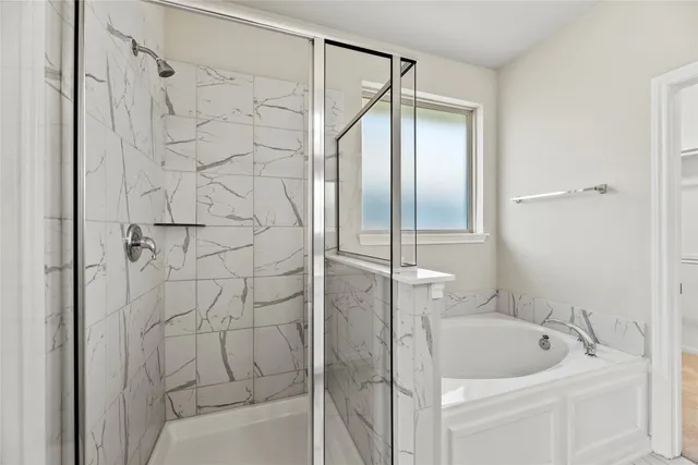 a spacious bathroom with a granite countertop sink a mirror and a shower