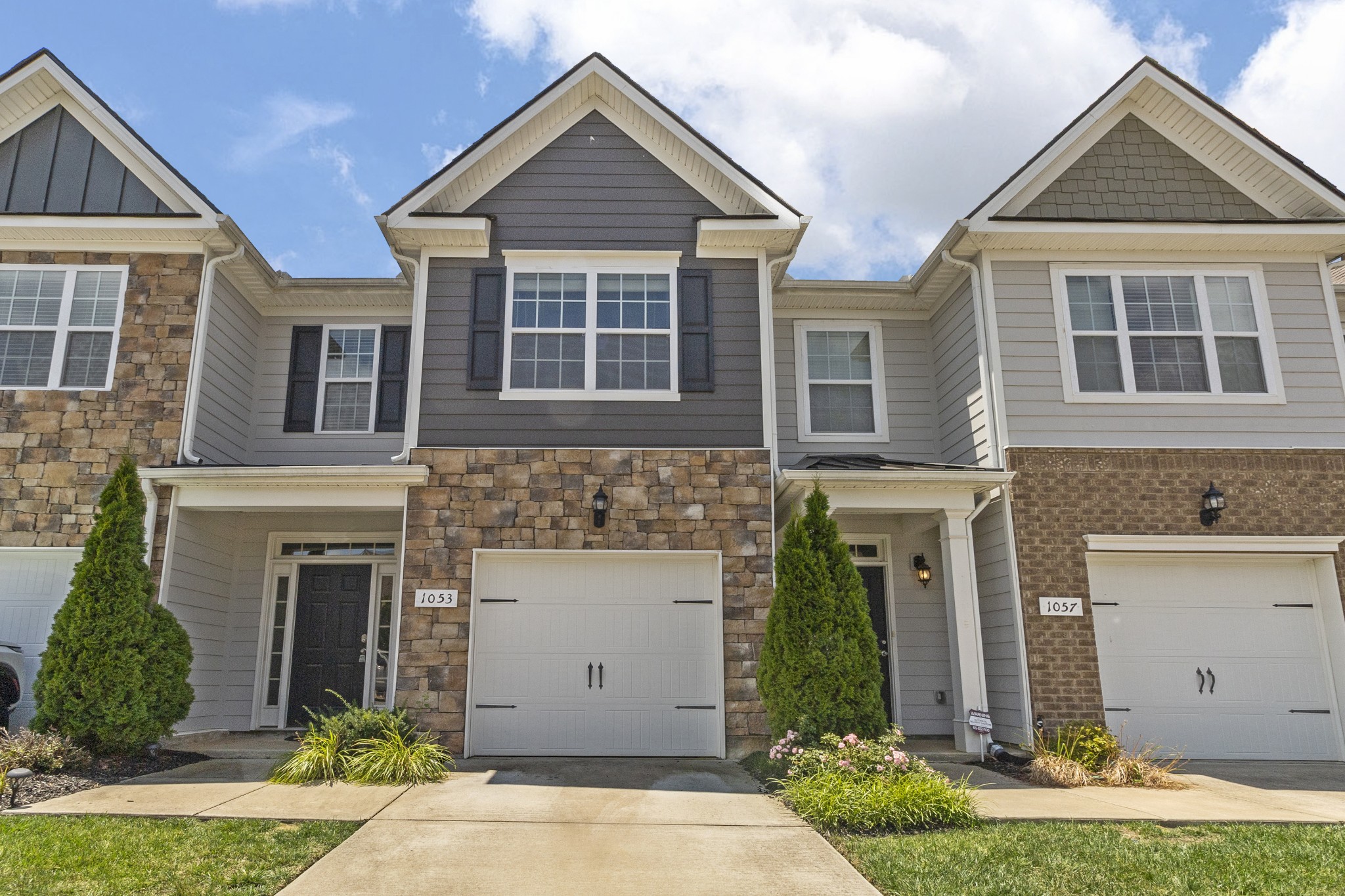 front view of a house with a yard