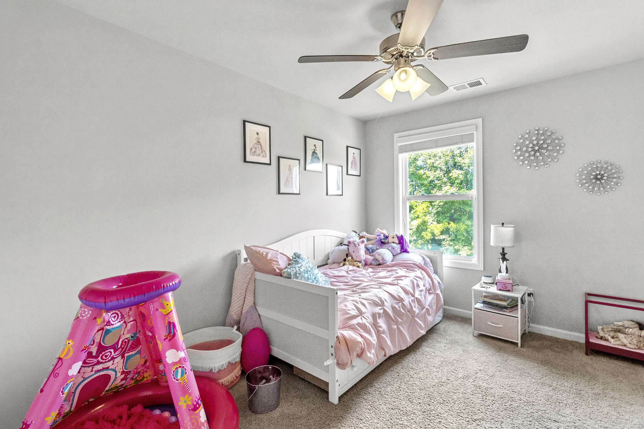 1053 Enclave Avenue Pleasant View, TN 37146 - Photo 18 of 27 a bedroom with a bed and a chandelier