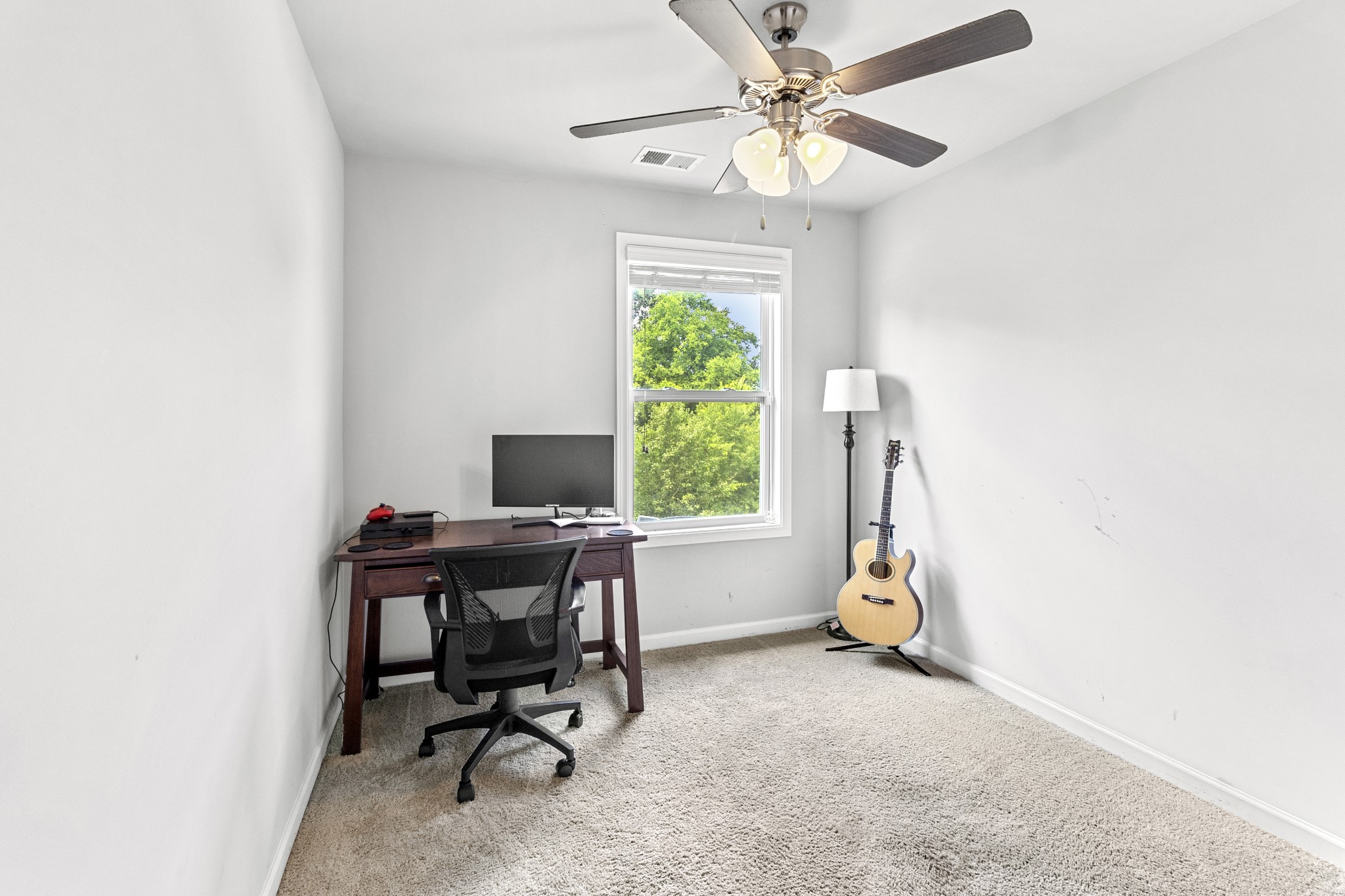1053 Enclave Avenue Pleasant View, TN 37146 - Photo 19 of 27 a view of a workspace with furniture and a window