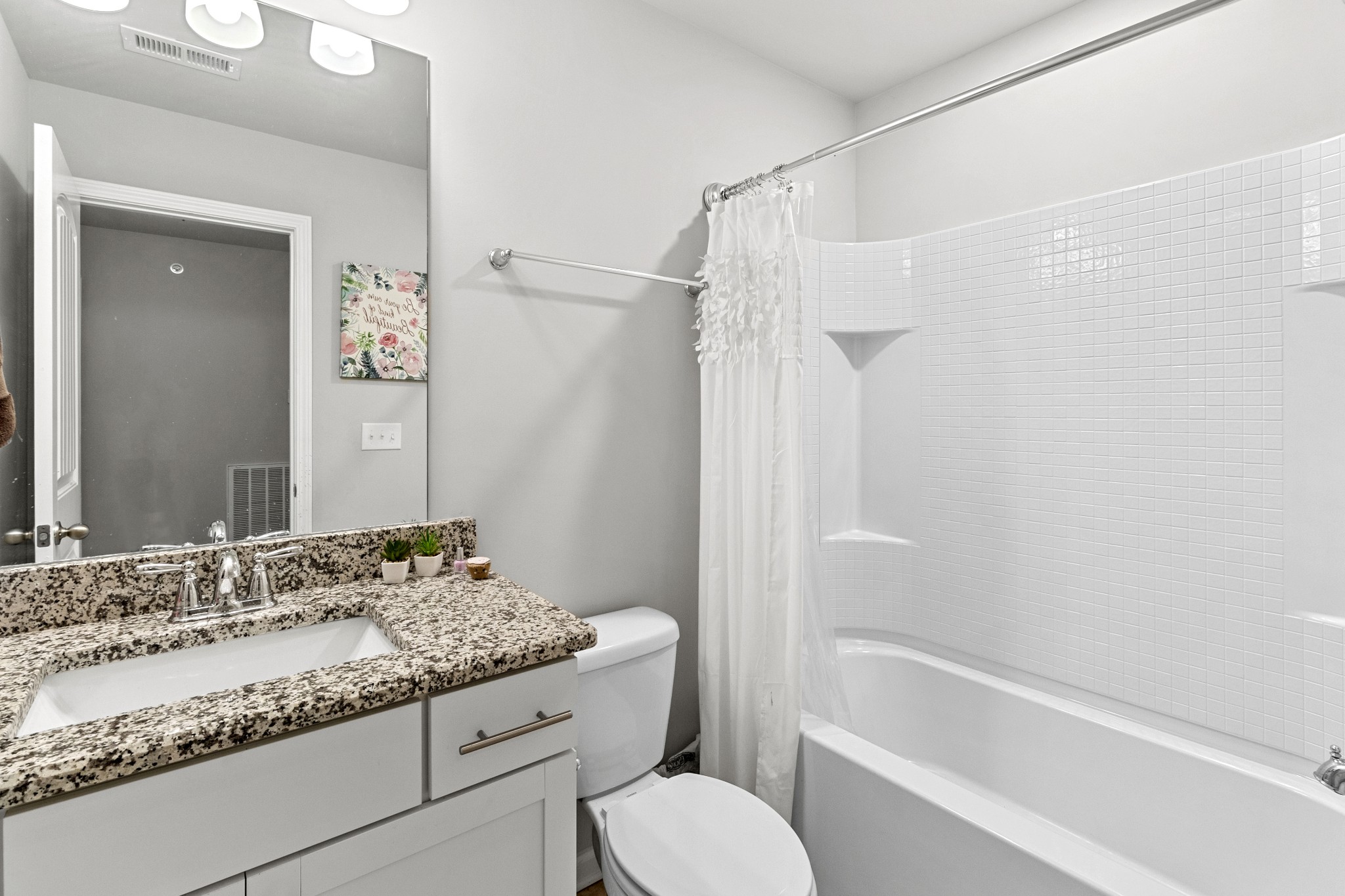 1053 Enclave Avenue Pleasant View, TN 37146 - Photo 20 of 27 a bathroom with a granite countertop sink toilet and shower