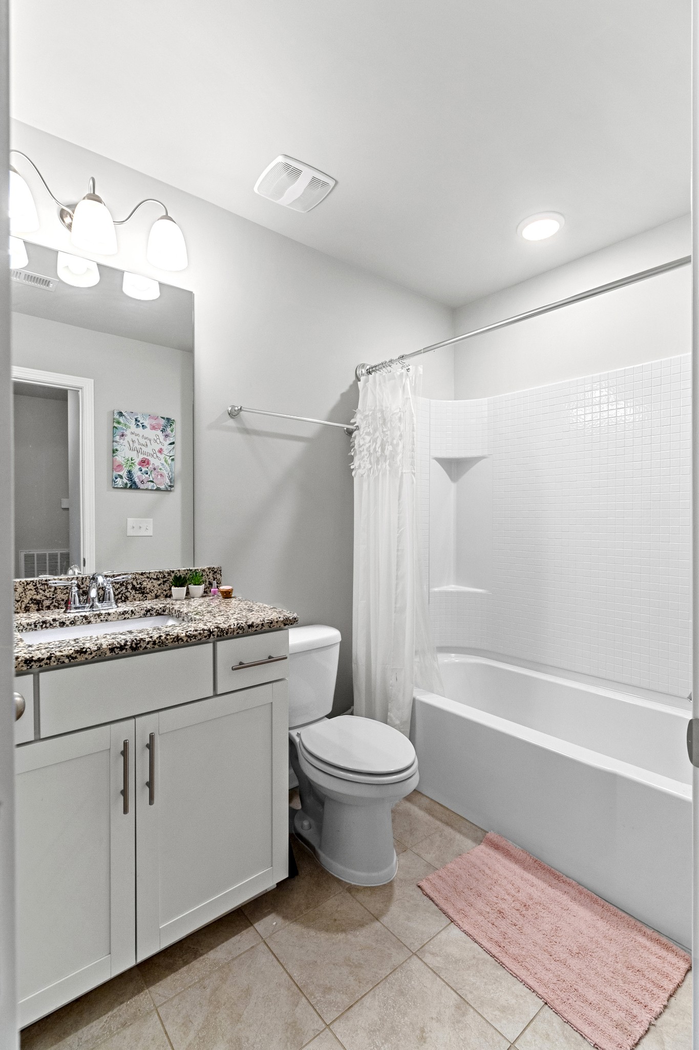 1053 Enclave Avenue Pleasant View, TN 37146 - Photo 21 of 27 a bathroom with a stove a sink and a mirror