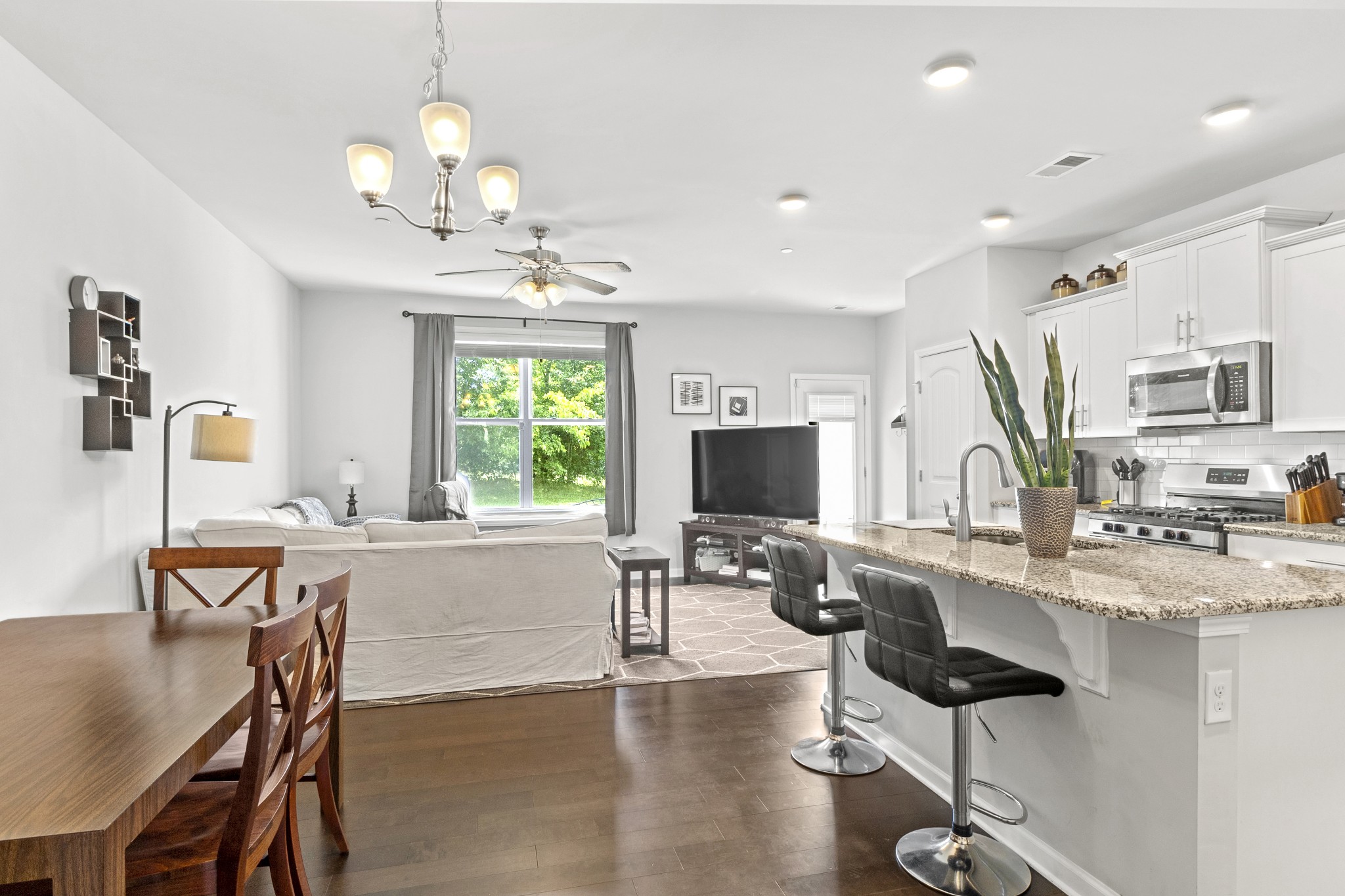 1053 Enclave Avenue Pleasant View, TN 37146 - Photo 5 of 27 a view of a dining room with furniture window and wooden floor