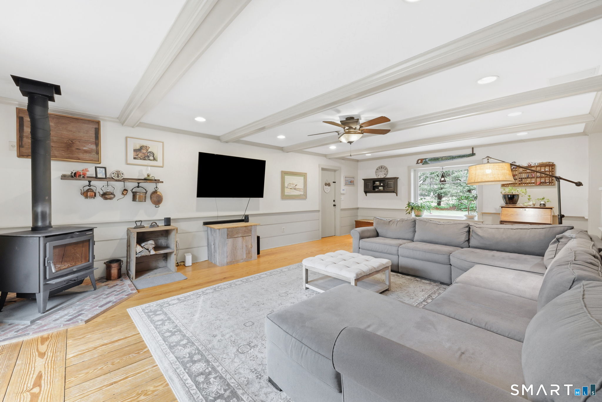 64 Tolland Farms Road Tolland, CT 06084 - Photo 13 of 33 Wood Stove Warms the Family Room