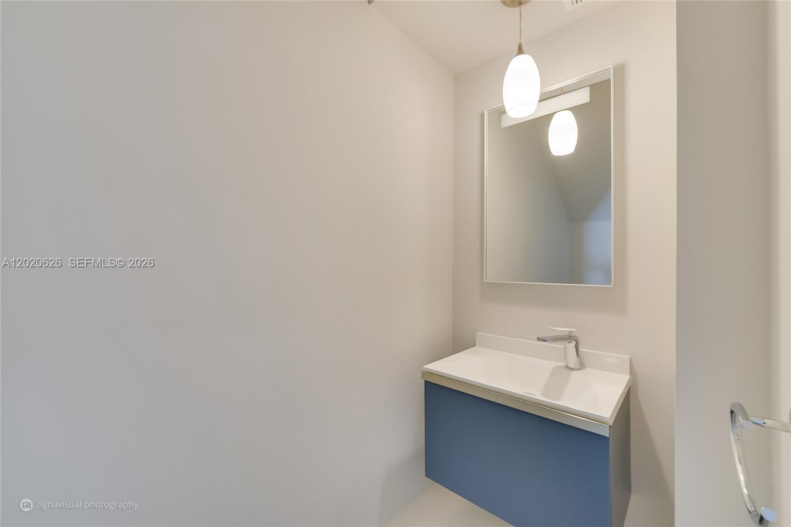 7701 Southwest 95th Terrace, Unit 1 Miami, FL 33156 - Photo 10 of 18 a bathroom with a sink and a mirror