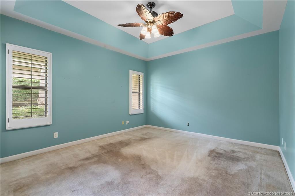 6273 Southeast Baltusrol Terrace Stuart, FL 34997 - Photo 24 of 68 a view of a room with windows and ceiling fan