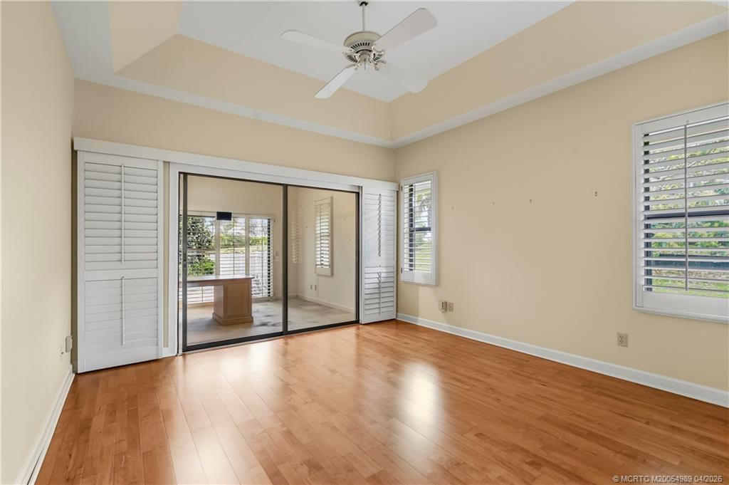 6273 Southeast Baltusrol Terrace Stuart, FL 34997 - Photo 27 of 68 wooden floor in an empty room with a window