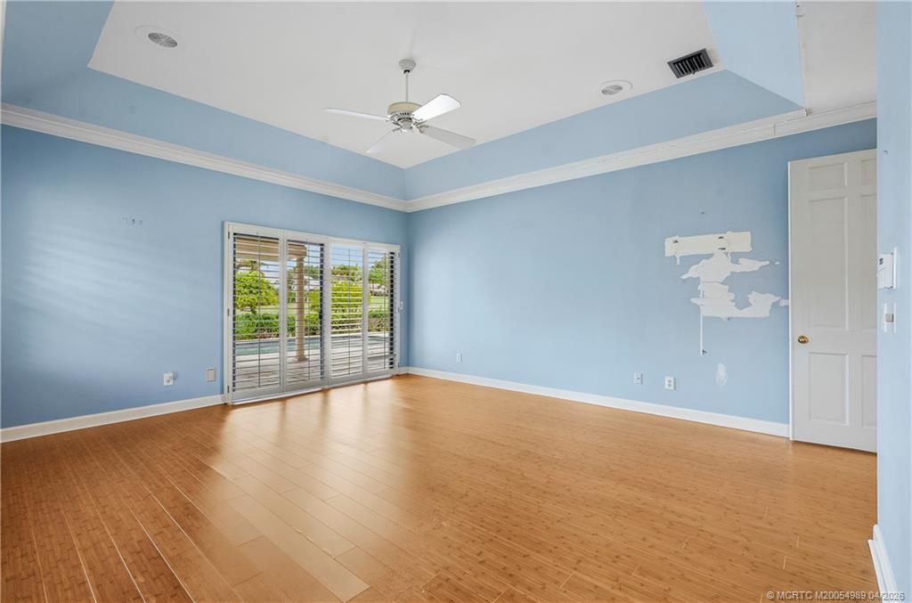 6273 Southeast Baltusrol Terrace Stuart, FL 34997 - Photo 35 of 68 wooden floor in an empty room with a window
