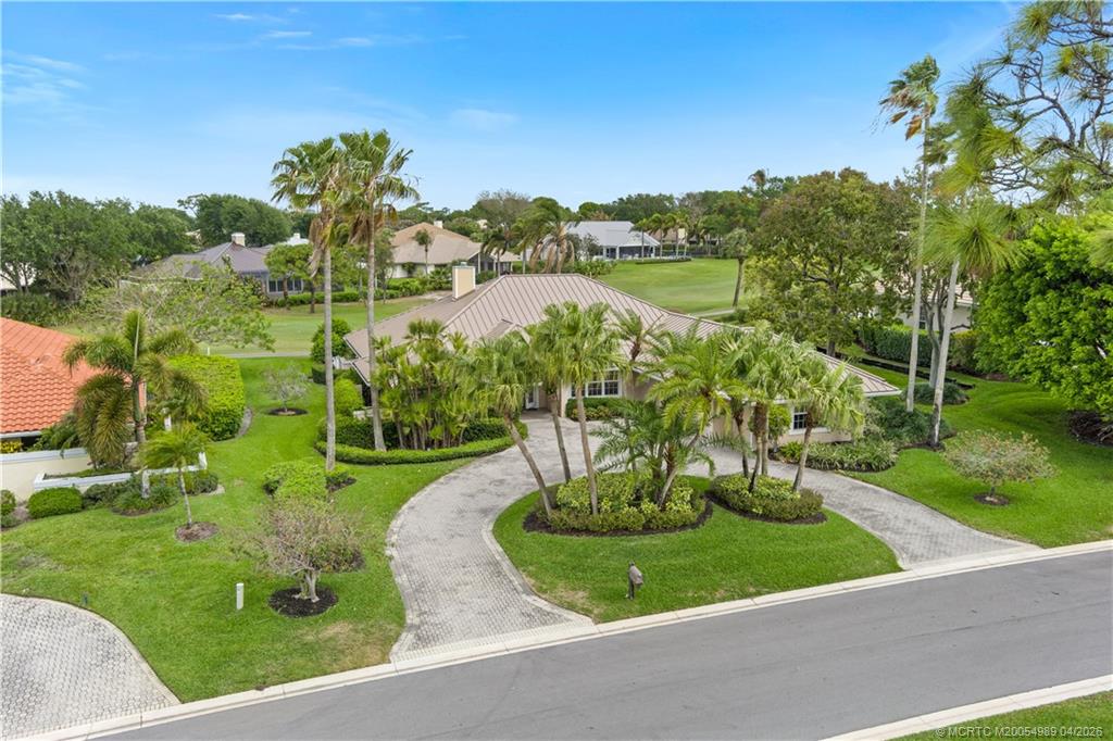 6273 Southeast Baltusrol Terrace Stuart, FL 34997 - Photo 59 of 68 a view of a garden with a lake view