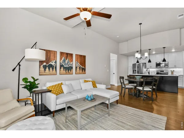 a kitchen with stainless steel appliances a refrigerator stove microwave and sink